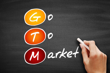 GTM - Go To Market, acronym business concept on blackboard