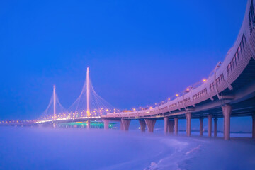 Saint Petersburg bridge. Russia highways. Expressway runs over bridge. Bridge of Gulf of Finland. Transport infrastructure of St. Petersburg. Overpass in winter fog. Expressway to winter Petersburg