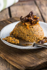 Vegetarian snack - beans and mushroom (honey mushrooms) pate on wooden board