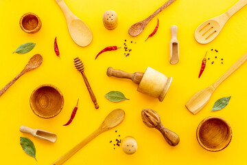 Fototapeta na wymiar Flat lay of wooden kitchen utensils and cookware