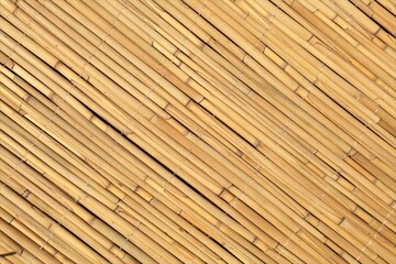 Wall detail made of thatch. Yellow reed wall decor.