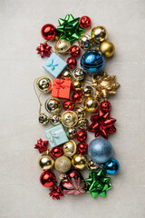 Bright Christmas composition of spruce red & gold Christmas decorations on white background. Winter holidays, New Year.