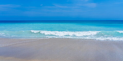 Runaway wave on the ocean coast in Florida in the spring. Turquoise ocean and perfect clear sand...