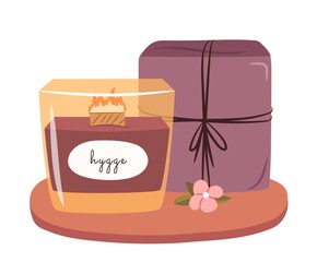 Hygge candle for present concept. Candle and a gift package. Vector flat