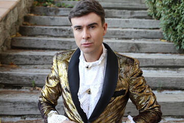 Gentleman showing opulence with golden outfit