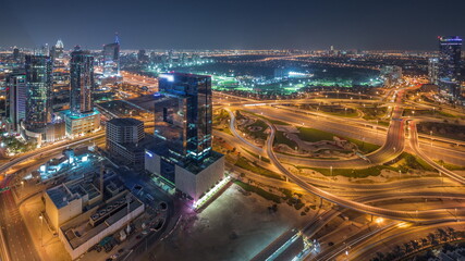 Fototapeta na wymiar Aerial panoramic view of media city district and highway junction all night timelapse