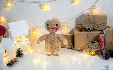 Concept decor for the birth of your own hands. Decorative toy crocheted, houses made of paper, gifts in craft paper.