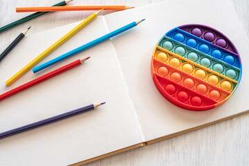 Sensory Fidget Toy and colorful pencils.