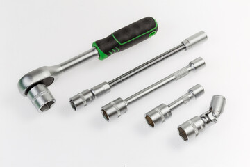 Ratchet wrench and different adapters with inserted interchangeable hexagonal sockets