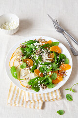 Spinach and quinoa salad with pears, oranges and ricotta. Healthy Meal prep. Plant-based dishes. Green living. Vegan recipe. Food styling. Vegetarian cuisine. Healthy eating. Weight loss food.