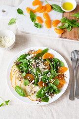 Spinach and quinoa salad with pears, oranges and ricotta. Healthy Meal prep. Plant-based dishes. Green living. Vegan recipe. Food styling. Vegetarian cuisine. Healthy eating. Weight loss food.