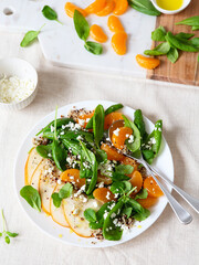 Spinach and quinoa salad with pears, oranges and ricotta. Healthy Meal prep. Plant-based dishes. Green living. Vegan recipe. Food styling. Vegetarian cuisine. Healthy eating. Weight loss food.