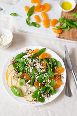 Spinach and quinoa salad with pears, oranges and ricotta. Healthy Meal prep. Plant-based dishes. Green living. Vegan recipe. Food styling. Vegetarian cuisine. Healthy eating. Weight loss food.
