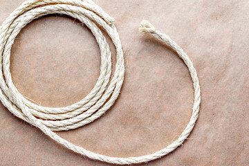 rope coiled at kraft paper on the background