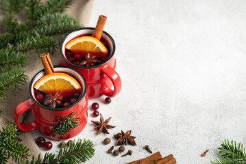 Two cups of mulled wine on white background with copy space