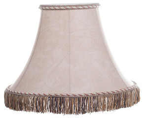 classic cut corner bell shaped beige tapered lamp shade with a brown fringe on a white background...