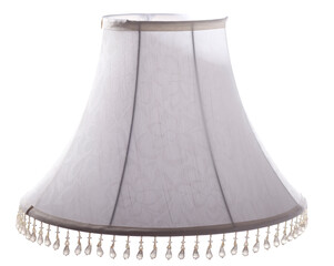 classic cut corner bell shaped grey tapered lampshade with a beaded fringe on a white background isolated close up shot