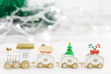 wooden toy locomotive, Christmas and New Year concept, blur, on white background
