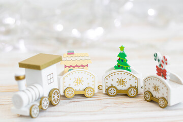 wooden toy locomotive, Christmas and New Year concept, blur, on white background