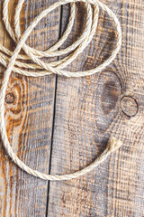 rope coiled on a wooden table