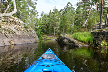 POV kayak view on a lake in Scandinavia with amazing nature