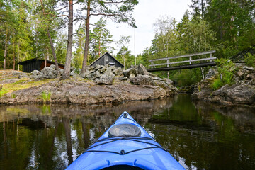 POV kayak view on a lake in Scandinavia with amazing nature