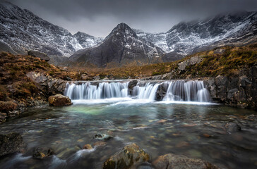 Fototapeta na wymiar Fairy Pools Skye Waterfall with Mountains