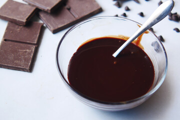 dark chocolate cream in a bowl on white 