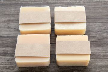 Mock up for small business homemade natural organic soap ,skin product mockup scene. Craft paper on cosmetic product ,natural aromatic spa treatment decoration on wooden vintage background