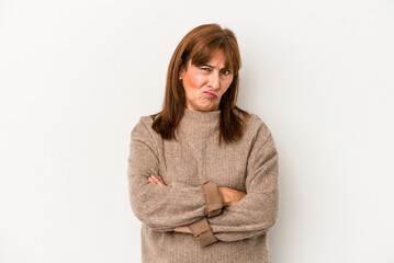Middle age caucasian woman isolated on white background frowning face in displeasure, keeps arms...