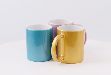 Colored cups for sublimation printing isolated on white background