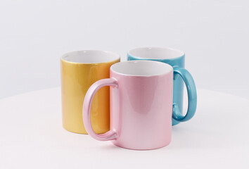 Colored cups for sublimation printing isolated on white background