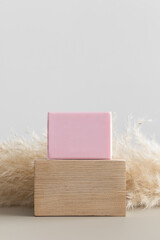 Soft pink soap mockup with a pampas decoration.