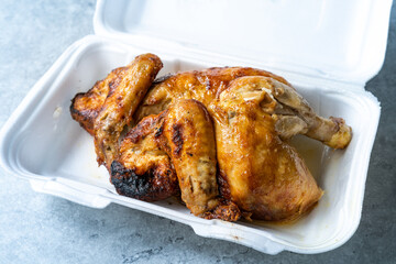 Take Away Whole Baked Chicken Ready to Eat and Serve in Plastic Container Package. Food Delivery Service.