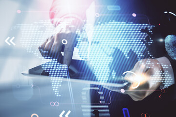 Multi exposure of man's hands holding and using a digital device and map drawing. International business concept.