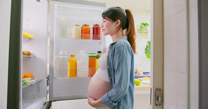 Asian pregnant woman prepare fruit