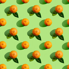 Seamless pattern with mandarin orange on green background.