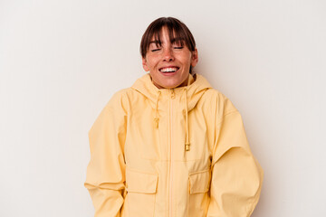Young Argentinian woman isolated on white background laughs and closes eyes, feels relaxed and happy.