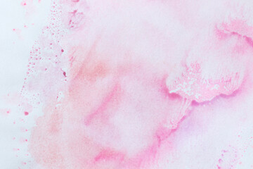 creative pastel pink aquarelle background with paint splashes