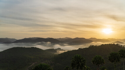 sunset sky in the morning and fog over mountains