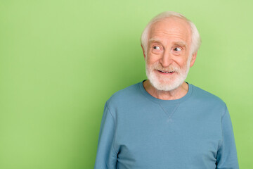 Photo of funny old beard man look empty space wear blue sweater isolated on green color background