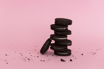 Chocolate cookie on pink background