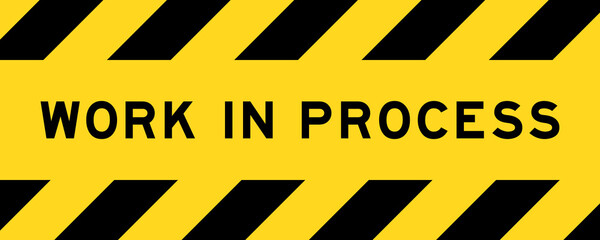 Yellow and black color with line striped label banner with word work in process