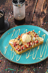 belgium waffles with strawberry and banana and a cup of coffee