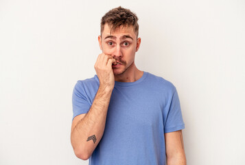 Young caucasian man isolated on white background looking sideways with doubtful and skeptical expression.