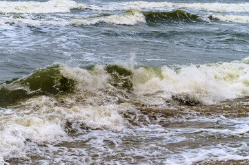 Seacoast. Tides and storms at sea. Waves on the Baltic Sea. Deserted seashore.