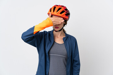 Young cyclist woman isolated on white background covering eyes by hands. Do not want to see something