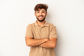 Young mixed race man isolated on grey background who feels confident, crossing arms with...