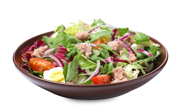 Bowl of delicious salad with canned tuna and vegetables on white background