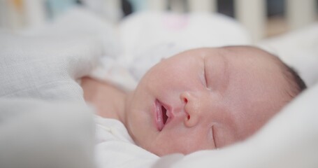 close up portrait face of cute lovely little newborn baby infant sleeping at home, Happiness Newborn Baby at Comfortable Home in Day Lighting Indoors	
